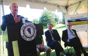  ?? Ernest A. Brown photos ?? Cumberland Mayor William S. Murray, left, jokes during his remarks at a dedication of Mercy Woods along with Lt. Gov. Dan McKee, center, and William Masuck, chairman of the Pawtucket Water Supply Board, on right.