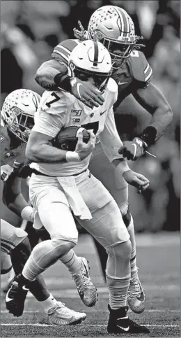  ?? JAY LAPRETE/AP ?? Ohio State defensive end Chase Young, right, sacks Penn State quarterbac­k Will Levis during the second half on Saturday in Columbus, Ohio.