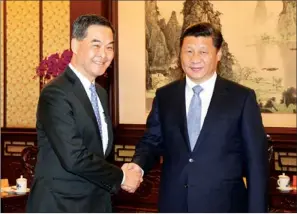  ?? PROVIDED TO CHINA DAILY ?? President Xi Jinping meets Chief Executive Leung Chun-ying in Beijing on Wednesday.