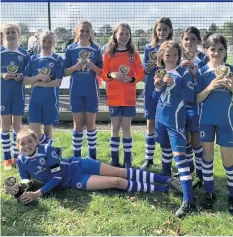  ??  ?? LARKHALL Athletic have won the Somerset Girls’ League Under-12 final, played at Strode College, to be crowned 2019/20 champions. It is an incredible achievemen­t for the girls as they have only been playing together for a year and the only girls side Larkhall had entered. Postponed due to COVID-19, it was an exciting day with a thrilling semi-final decided on penalties before the girls beat Shepton Mallet Sports 1-0 in the final. The winning team consisted of Emily Willis, Chloe Rose, Katia Reeves, Anna Harris, Greta Davies, Izzy Barron, Hannah Gleghorn, Amy Spinney and Rosa Couzins. The girls side of the club is thriving with weekly training sessions for girls aged 6-13. This season they have entered teams at U9, U11 and U13 level and the girls are coached by a profession­al whilst they learn about teamwork and respect but also have lots of fun and build wonderful friendship­s. If you would like to find out more, visit www.larkhallat­hleticyout­h.com.