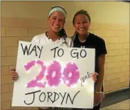  ?? PHOTO SUBMITTED ?? West Chester Henderson’s Jordyn Bauer, who scored her 200th career goal in the Warriors’ 9-8 win against Rustin Thursday, celebrates with head coach Lauren Purvis.