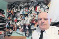  ?? AP ?? Tim Jaccard sits in front of snapshots of some of the children who were safely relinquish­ed under a ‘Safe Haven’ programme he started 17 years ago, in Wantagh, New York.