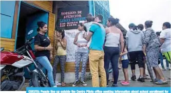  ?? —Reuters ?? CUCUTA: People line up outside the Centro Piloto office seeking informatio­n about school enrollment for undocument­ed Venezuelan children in Cucuta, Colombia.