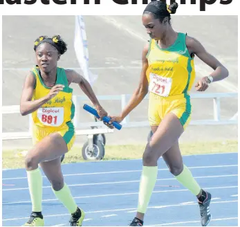  ?? FILE ?? St Mary High school’s Keresa Richardson (right) passes the baton to teammate Janelia Campbell during the Class One girls 4x100m final at the Eastern Athletics Championsh­ips at the National Stadium in 2019.