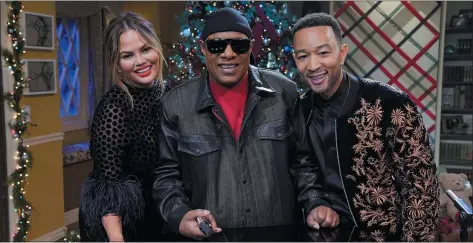  ?? NBC ?? From left, Chrissy Teigen, Stevie Wonder and John Legend star in the NBC special “A Legendary Christmas with John and Chrissy.”