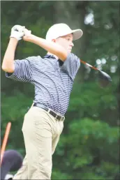  ?? STAFF PHOTO BY MICHAEL REID ?? La Plata freshman Tyler Jackson watches his tee shot Tuesday at Swan Point. The freshman shot a team-best 2-over-par 38 as the Warriors fell to Northern 153-170.
