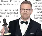  ??  ?? PRIZE GUY Picking up an Olivier award