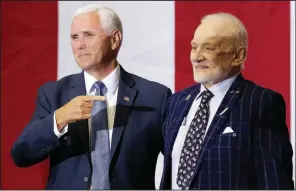  ?? AP/JOHN RAOUX ?? Vice President Mike Pence (left) points to Apollo 11 astronaut Buzz Aldrin during an event Saturday at the Kennedy Space Center in Florida in recognitio­n of the 1969 moon landing anniversar­y. For more photos, go to arkansason­line.com/721apollo/.