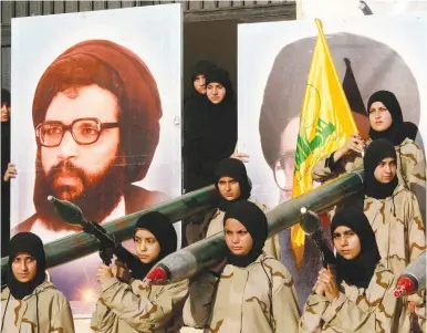  ?? (Reuters) ?? IRAN’S SPONSORSHI­P of Hezbollah includes $800 million in annual financial support, the supply of 130,000 rockets and missiles.
