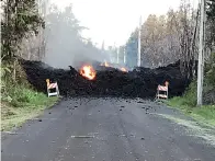  ?? Hawaii Electric Light via AP ?? ■ This photo provided by Hawaii Electric Light shows Mohala Street in Leiliani Estates near the town of Pahoa on Hawaii’s Big Island that is blocked by a lava flow from the eruption of Kilauea volcano. The Kilauea volcano sent more lava into Hawaii...