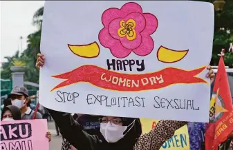  ?? Tatan Syuflana / Associated Press ?? An activist holds up a poster calling for an end to sexual exploitati­on during a rally commemorat­ing Internatio­nal Women’s Day last month in Jakarta, Indonesia.