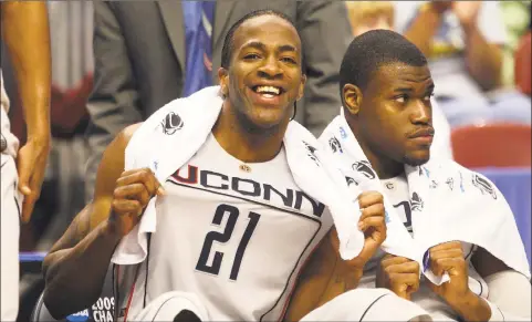  ?? Jim McIsaac / Getty Images ?? UConn’s Stanley Robinson smiles from the bench during a second-round NCAA tournament win over Texas A&M on March 21, 2009, in Philadelph­ia. Robinson was found dead on Tuesday night. He was 32.