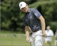  ?? CHUCK BURTON — THE ASSOCIATED PRESS ?? Brandt Snedeker reacts to his putt on the first hole during the final round of the Wyndham Championsh­ip golf tournament at Sedgefield Country Club in Greensboro, N.C., Sunday.