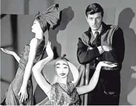  ?? FILE PHOTO BY AP ?? French fashion designer Hubert de Givenchy poses with mannequins in his shop in Paris in 1952, the year the designer started his own label.