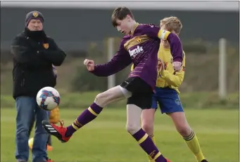  ??  ?? Jesse Dempsey of Wexford Albion controls the ball as Ben Weldon of Douglas Hall closes in.