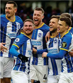  ?? ACTION IMAGES ?? Jubilant: Brighton players celebrate Joel Veltman’s goal