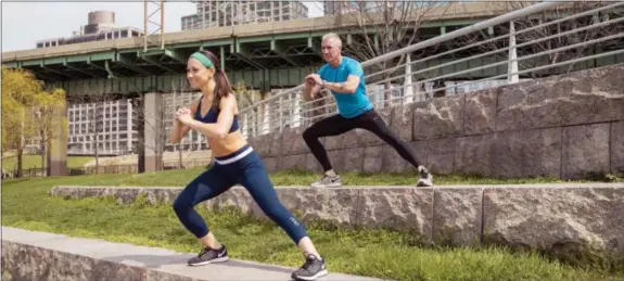  ?? JAMIE HESS VIA AP ?? Jamie and George Hess working out together in New York City. It’s tempting to blow off a workout, but getting sweaty with your significan­t other makes a workout more fun and ups the intensity ante.