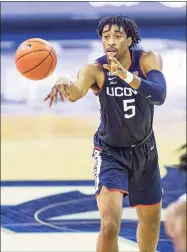  ?? John Peterson / Associated Press ?? UConn’s Isaiah Whaley passes against Creighton on Saturday in Omaha, Neb.