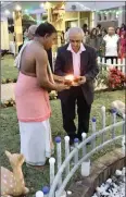  ?? PICTURE: SUPPLIED ?? Guru Anand Chandrasek­aran, left, and Choonilal Valabjee, one of the oldest residents in the community, paid homage to the indentured labourers by lighting a heritage lamp at the Shree Veeraboga Emperumal Temple’s memorial garden in oThongathi on...