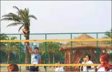  ?? PROVIDED TO CHINA DAILY ?? From left: Residents play beach volleyball at a park in Chengdu.