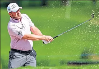  ?? ?? Scot Richie Ramsay blasts out of the sand at The Belfry