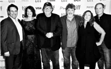  ??  ?? Michael Moore ( third from left) with the team behind Fahrenheit 11/9