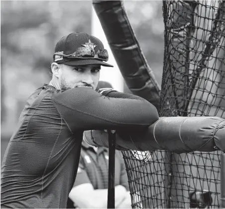  ?? Photos by Karen Warren / Staff photograph­er ?? Outfielder George Springer, taking in batting practice during the Astros’ first full squad spring training workout Monday, said “it’s way to early” for him to worry about when he’ll receive a contract extension. Springer is playing this season on a $21 million deal.