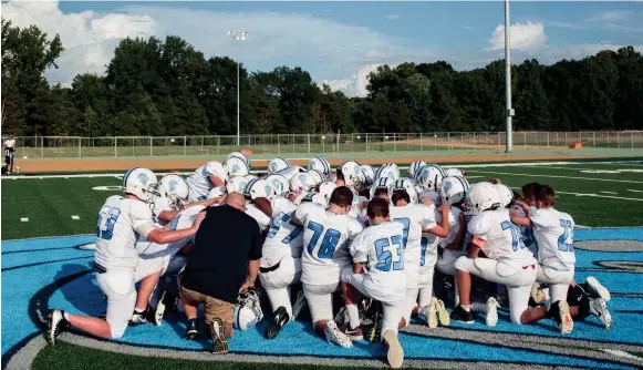  ??  ?? September 06 2018 - The Lakeland team gathers together at midfield before the start of the first home game to take place at Lakeland Middle School. Until the start of this game, all of Lakeland Middle School's football games were played away. BRAD VEST/THE COMMERCIAL APPEAL,