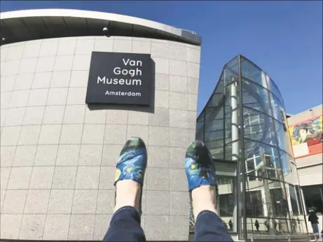  ?? Amanda Altieri / Contribute­d photo ?? Amanda Altieri shows off her custom-painted canvas shoes featuring John Murphy's depiction of "Starry Night" outside the Vincent Van Goh Museum in Amsterdam.