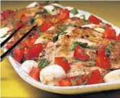  ?? TERRENCE ANTONIO JAMES/CHICAGO TRIBUNE; SHANNON KINSELLA/FOOD STYLING ?? Griddle-seared chicken takes to an endless range of flavors. Here the chicken breasts are topped with Caprese-style tomatoes.