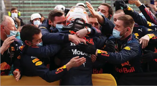  ??  ?? Max Verstappen celebrates with his team at Red Bull after winning the Emilia Romagna Grand Prix in Imola yesterday