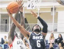  ?? Sam Macdonald ?? St. F.X. X-men junior guard Justin Andrew soars for two against the UNB Reds in Atlantic University Sport basketball action earlier this season.