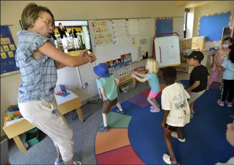  ?? Cliff Grassmick / Staff Photograph­er ?? Teacher Ina Rochelle instructs a movement class on Wednesday at the Mapleton Early Childhood Center in Boulder. New this summer, through a partnershi­p with Impact on Education, this is a program for about 160 incoming kindergart­en students at three sites, two in Boulder and one in Lafayette.