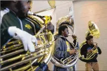  ??  ?? Douglass High marching band tuba section leader Stephon Wheeler (right) took to social media and asked Douglass alumni and rapper Killer Mike to donate. Killer Mike donated and enlisted other stars.