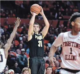  ?? STEPHEN HAAS THE ASSOCIATED PRESS ?? Purdue guard Dakota Mathias shoots against Illinois guard Da'Monte Williams in February. Mathias has made 46 per cent of his 3-point attempts coming into the tournament.