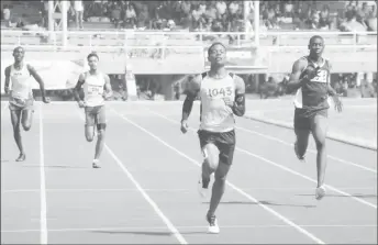  ?? (Orlando Charles photo) ?? Daniel Williams broke his third record of the meet on his way to winning the U-18 400m yesterday.