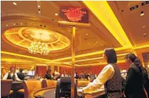  ?? BOBBY YIP/ REUTERS ?? A look inside the posh casino at the Four Seasons Hotel Macau. Macau is the only place in China where casinos are allowed.