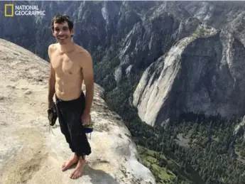  ?? JIMMY CHIN/NATIONAL GEOGRAPHIC/THE ASSOCIATED PRESS ?? Alex Honnold poses for a photo atop El Capitan in Yosemite National Park, Calif., after his death-defying climb.