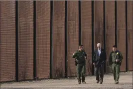  ?? ANDREW HARNIK — THE ASSOCIATED PRESS FILE ?? President Joe Biden walks with U.S. Border Patrol agents along a stretch of the U.S.Mexico border in El Paso Texas, on Jan. 8.