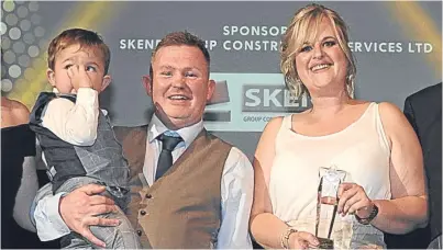  ?? Picture: George McLuskie. ?? Daniel Cornet with parents Nick Cornet and Louise Paton after he won the Child of Achievemen­t Award at the Kingdom FM Local Hero Awards.