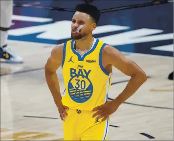  ?? DAVID ZALUBOWSKI — THE ASSOCIATED PRESS ?? Stephen Curry had 35 points on 14-of-23 shooting against Denver on Thursday, but the Warriors lost to the Nuggets.