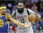  ?? Karen Warren / Houston Chronicle ?? Guard James Harden, right, tries to keep the Warriors’ James Michael McAdoo at arm’s length Tuesday, just like he has talk of taking a rest.