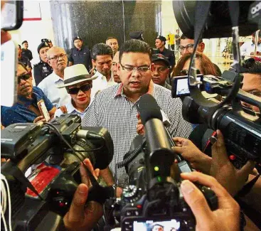  ??  ?? Fielding the press: Lokman speaking to reporters at Menara Marinara in Kuala Lumpur.