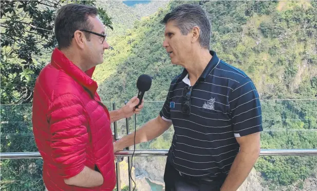  ?? Picture: SUPPLIED ?? ON TOUR: Ingenia Holidays' Benjamin Starr interviewi­ng Skyrail boss Craig Pocock at the Barron Falls lookout.