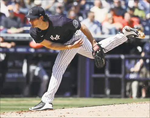  ?? Frank Franklin II / Associated Press ?? The New York Yankees’ Gerrit Cole delivers a pitch during the second inning of a spring training game against the Detroit Tigers in Tampa, Fla., in February.