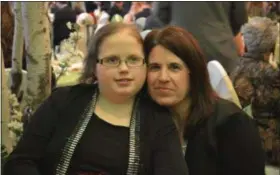  ?? KEITH REYNOLDS — THE ASSOICATED PRESS ?? Landry Cole and her mother Heather Cole posing at the American Cancer Society’s Life Savers Ball on March 4. Landry, 16, of Wellington, was honored at the event.