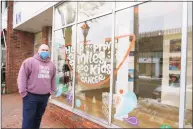  ?? Grace Duffield / Hearst Connecticu­t Media ?? LivFree, an organizati­on to help families impacted by pediatric cancer, has moved to 107 Main St. in New Canaan. Daniel Vieira showed off the store front on Wednesday, which has many pictures of the over 300 families the nonprofit has sponsored for a fun outing.