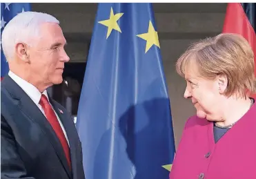  ?? FOTO: DPA ?? Schau mir in die Augen: Angela Merkel und Mike Pence, amerikanis­cher Vizepräsid­ent, in München.