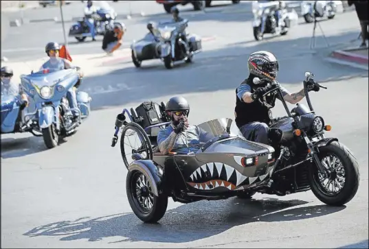  ?? Chase Stevens Las Vegas Review-Journal @csstevensp­hoto ?? Army veterans Jose “Freddy” Ruiz, left, of San Antonio, and Richard Neider, of Phoenix, depart from the Nevada State Veterans Memorial on Saturday for the Veterans Charity Ride to the Sturgis Motorcycle Rally in South Dakota.