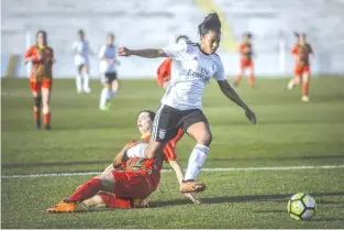  ?? — AFP photo ?? Benfica's Brazilian forward Geyse Ferreira charges away from an opponent.